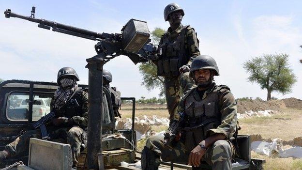 Cameroonian soldiers patrol on 12 November 2014 in Amchide, northern Cameroon