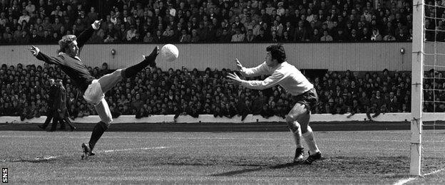 Denis Law tries to lob England goalkeeper Gordon Banks