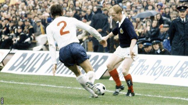 England's David Nish puts pressure on Jimmy Johnstone