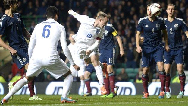 Wayne Rooney scores with a header against Scoland at Celtic Park