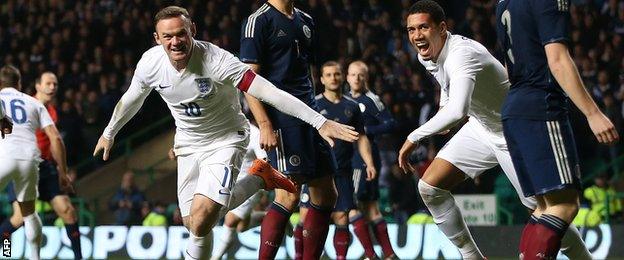 Wayne Rooney celebrates putting England 2-0 ahead at Celtic Park