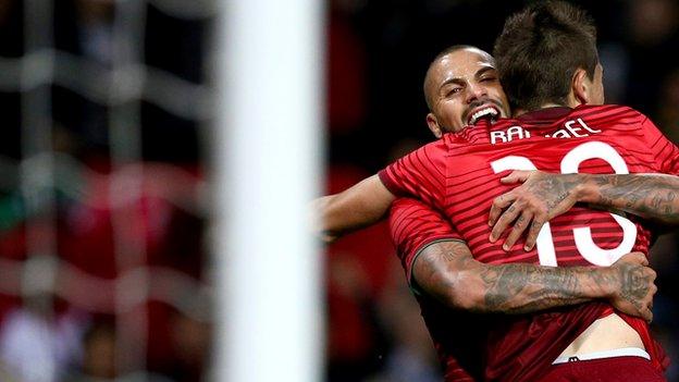 Ricardo Queresma and Raphael Guerreiro celebrate Portugal's winner against Argentina