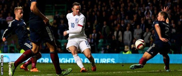 Wayne Rooney scores England's third