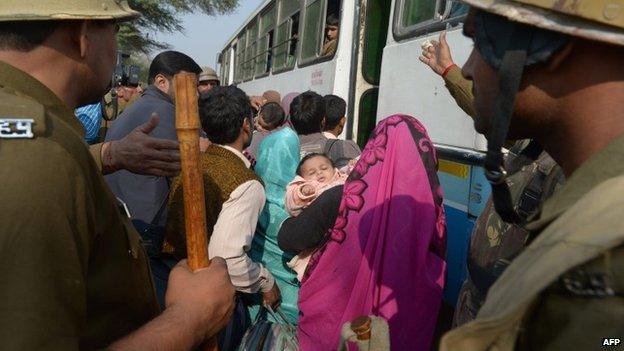 Supporters of self-styled "godman" Rampal Maharaj leave his ashram in Hisar on November 19, 2014.