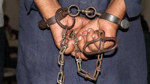 A prisoner in handcuffs