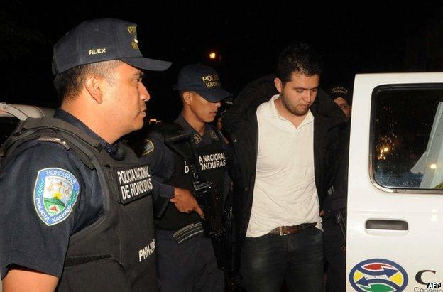 Aris Valentin Maldonado is escorted by police in Santa Barbara, Honduras, 18 November