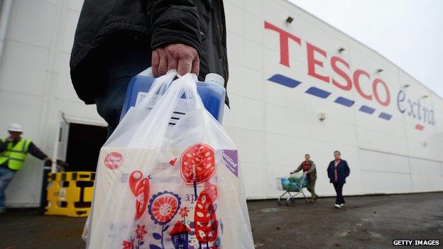 Tesco shopper with a carrier bag