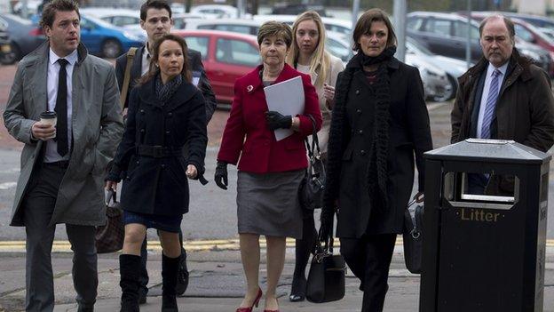 Robert Stuart's widow, Judith, arrives at the inquest with her family