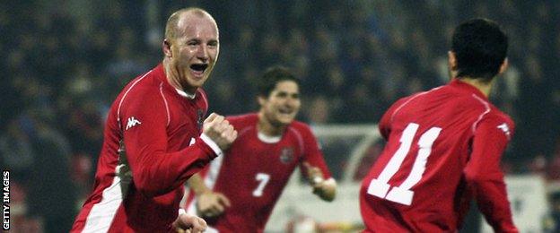 Hartson celebrates scoring for Wales