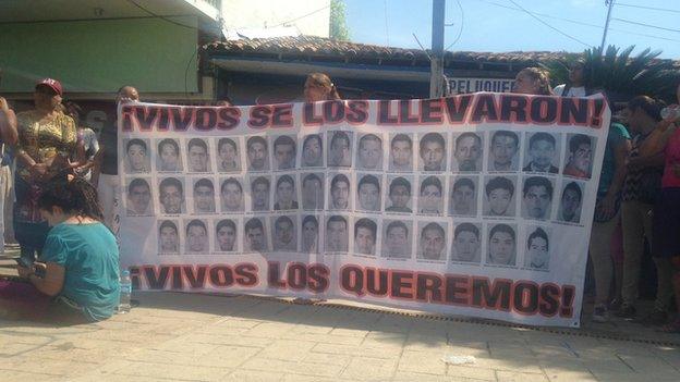 A banner showing the 43 Mexico students, who are missing, presumed dead