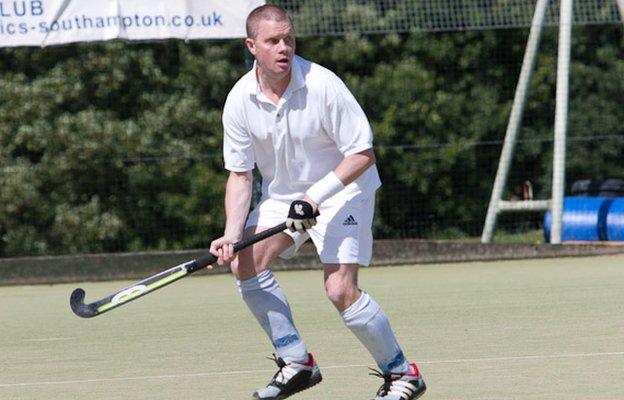 Tim playing hockey