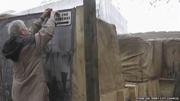 A sign pointing to the trench