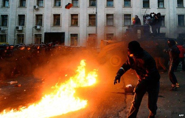 Riot police clash with protesters outside the presidential administration office in Kiev on 1 December 2013