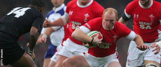 Wales' Martyn Williams side-steps All Blacks wing Joe Rokocoko in 2008