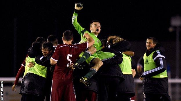 Wales celebrate victory in their opening game against England