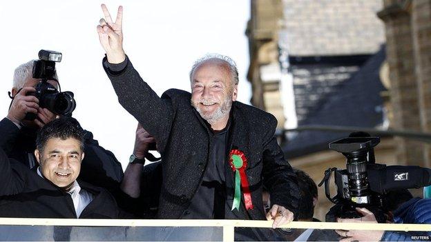 George Galloway greets supporters following his by-election victory