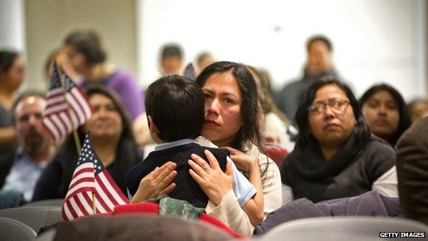 Martha Moran, with her six-year-old son Tonatiuh Moran, watch Obama speech