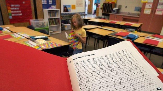 A handwriting exercise book in a classroom