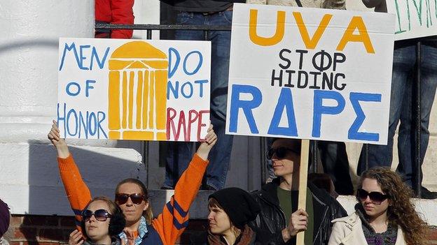 Protestors gather outside the Phi Kappa Psi fraternity at the University of Virginia