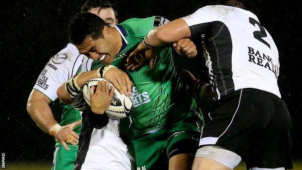 Connacht's Mils Muliaina is tackled by Zebre pair Andries van Schalkwyk and Oliviero Fabiani