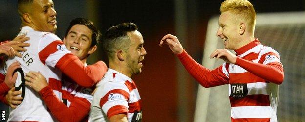 Ali Crawford is hailed by his team-mates after netting the third goal for Hamilton Academical