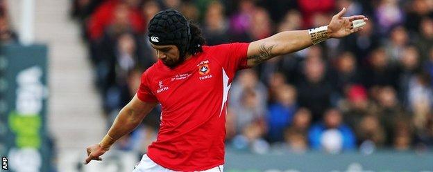 Latiume Fosita scores a penalty for Tonga against Scotland