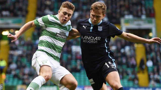 Celtic's James Forrest (left) retains possession from Dundee's Greg Stewart in the home side's 2-1 win.