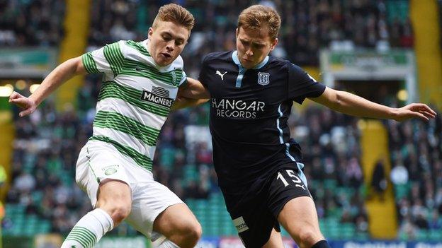 Celtic's James Forrest (left) retains possession from Dundee's Greg Stewart in the home side's 2-1 win.