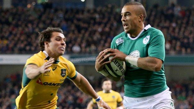 Simon Zebo runs in Ireland's first try despite Nick Phipps's efforts