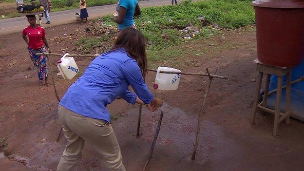 Makeshift wash bottles at an checkpoint in Sierra Leone, 21 November 2014