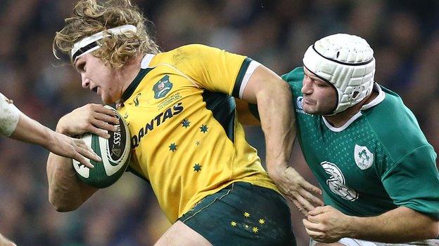 Rory Best is about to tackle Australia's Michael Hooper in Saturday's game in Dublin