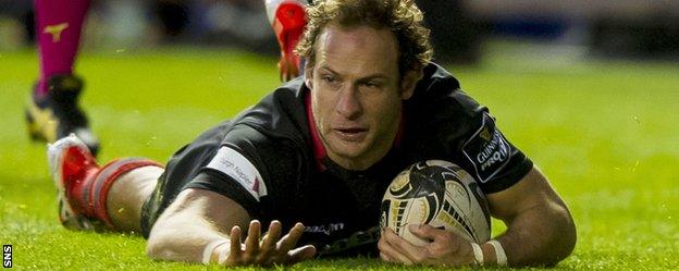 Edinburgh's Andries Strauss touches down for the first try of the match