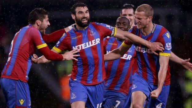 Mile Jedinak (centre) celebrates