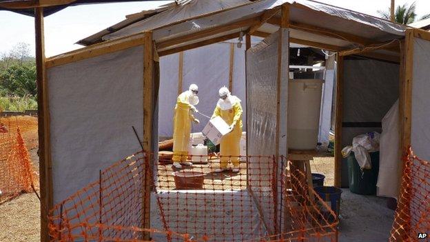 Medecins Sans Frontieres members prepare Ebola isolation and treatment areas for their Ebola in Gueckedou, Guinea. Photo: March 2014