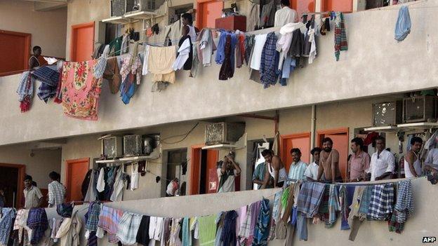 Migrant workers hang their laundry from balconies in Dubai