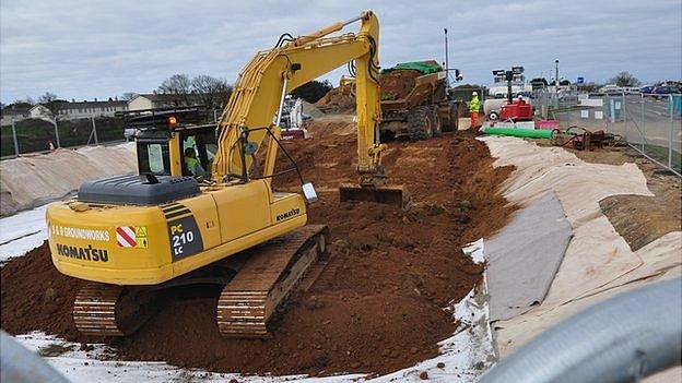 Soil contaminated with PFOS being buried in a bund by the entrance to Guernsey Airport