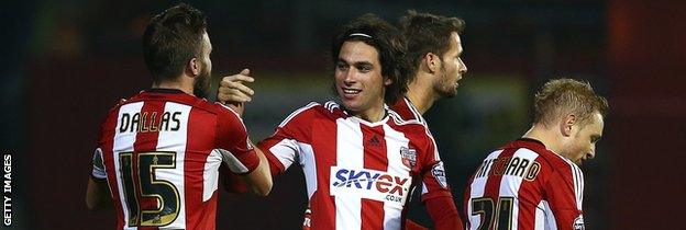 Brentford midfielder Jota (centre) celebrates his winning goal against Fulham on Friday night