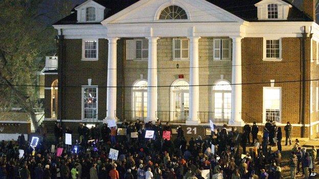 Protestors gather outside the Phi Kappa Psi fraternity at the University of Virginia on Saturday night