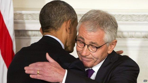 President Barack Obama and Defence Secretary Chuck Hagel embrace after speaking about Hage's resignation during an event in the State Dining Room of the White House in Washington on 24 November 2014