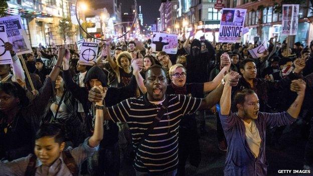 Protesters march through the streets of New York on 24 November 2014 in New York City