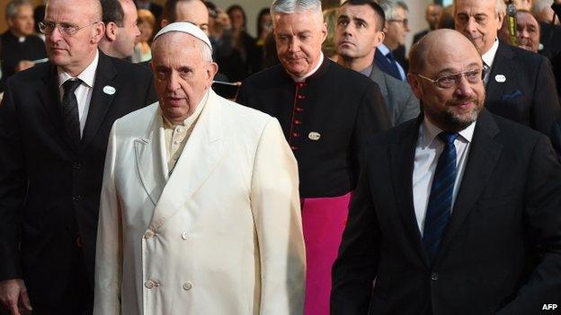 Pope Francis is greeted by the President of the European Parliament Martin Schulz (right) upon his arrival at the European Parliament, on 25 November 2014