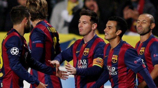 Lionel Messi celebrates scoring against Apoel Nicosia