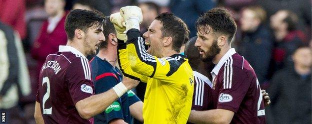 Former Rangers goalkeeper Neil Alexander celebrates Hearts' 2-0 win