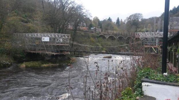 Scaffolding on chain bridge