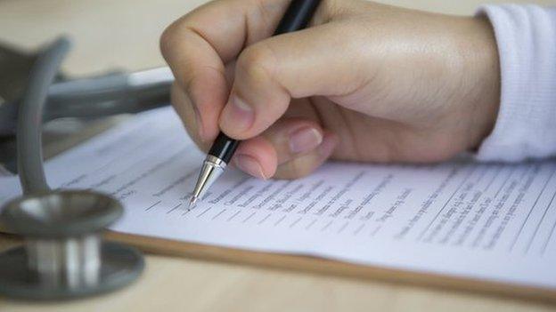 Doctor writing prescription