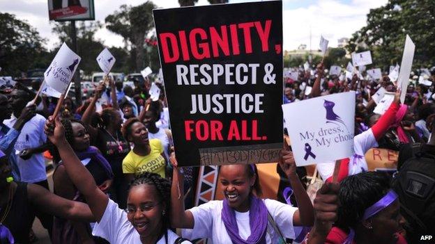 Women hold up placards and shout slogans during a rally against violence to women, on 17 November in Nairobi, Kenya