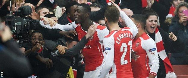 Yaya Sanogo (left) celebrates