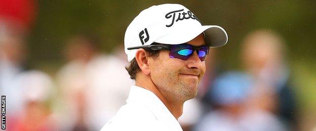 Adam Scott shows his disappointment after a poor approach shot at the 16th in Sydney