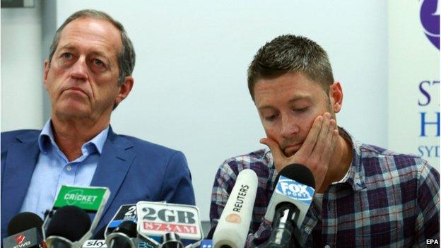 Australia captain Michael Clarke (R) reads a statement as Peter Brukner, Australian Cricket team doctor, looks on during a press conference at St Vincent's hospital, Sydney, Australia, 27 November 2014, following the death of Australian cricketer Phillip Hughes