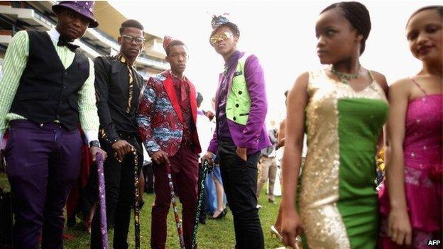 Racegoers participate in a fashion competition during the Durban July horse races on 6 July 2013 in Durban, South Africa